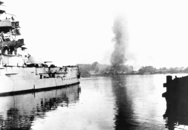 German battleship Schleswig-Holstein bombarding Westerplatte, Danzig, 1 September 1939. That attack was the first clash between Polish and German forces during the Invasion of Poland and thus the first battle of the European theater of World War II.