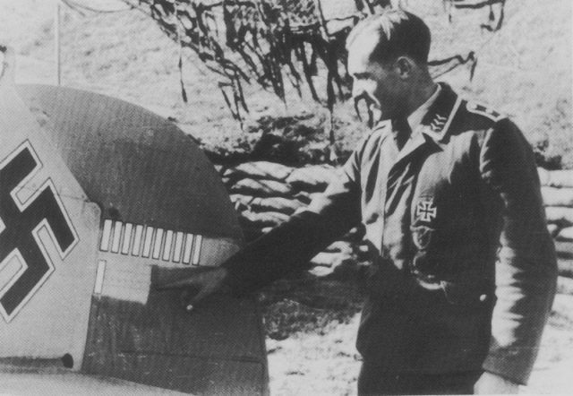 Sergeant Schnell Siegfried of the 4.JG2 Squadron presents the marks of victories on the tail of his Messerschmitt fighter Bf 109E. [Via]