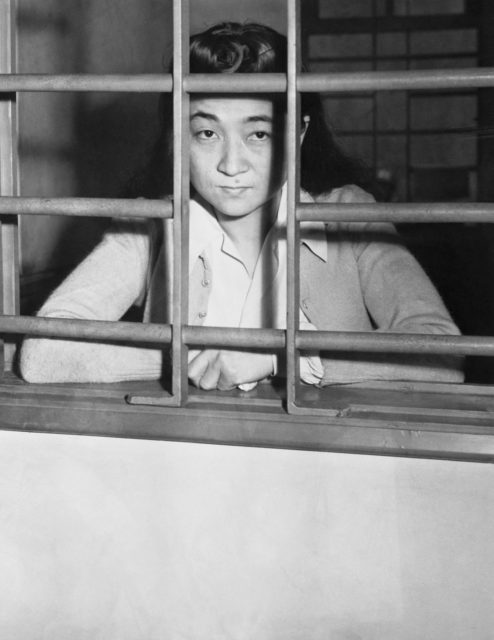 Iva Toguri D'Aquino behind bars in Yokohama, Japan in 1945