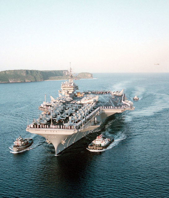 USS Kitty Hawk surrounded by ships