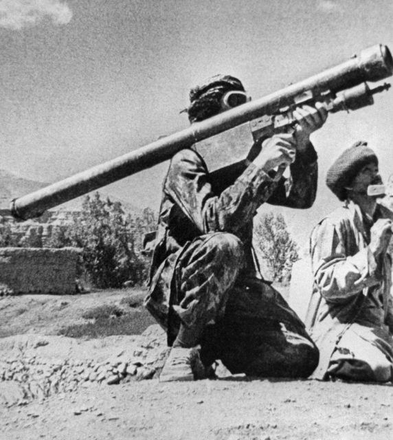 Mujahid fighting kneeling while aiming an FIM-92 Stinger