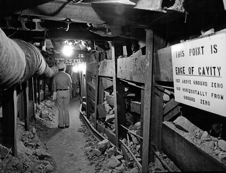 Man walking through an underground tunnel