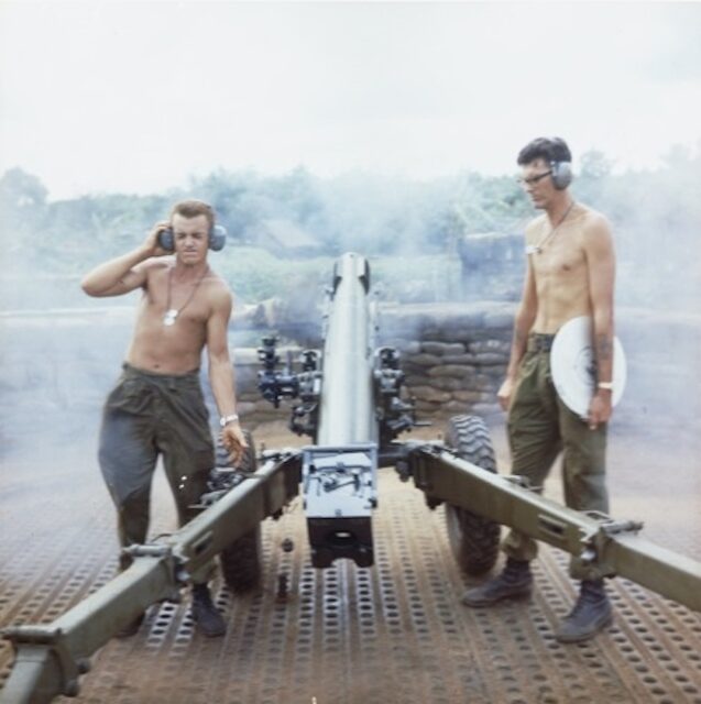 Two Australian artillerymen firing a 105 mm L5 PACK Howitzer