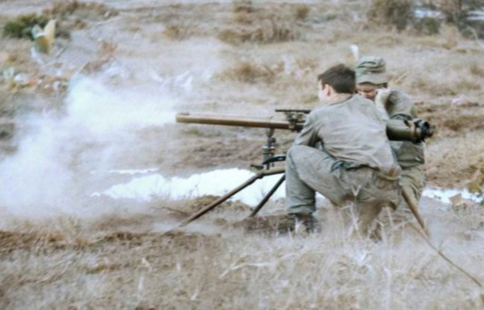 Lance Cpl. Phil Dixon and Pvt. Ian Dixon firing a 57 mm recoilless rifle