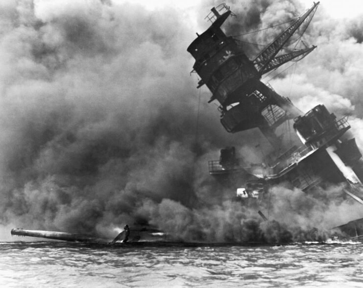 Wreck of the USS Arizona (BB-39) shrouded in smoke