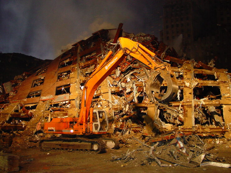 Bulldozer parked in front of the remains of 7 World Trade Center