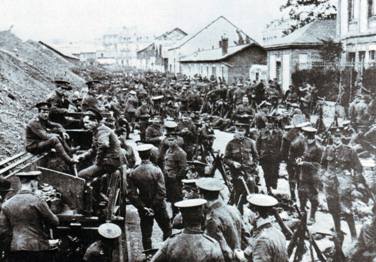 British troops standing on the outskirts of a town