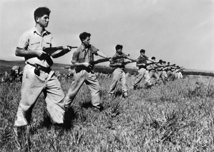 Haganah trainees aiming their rifles