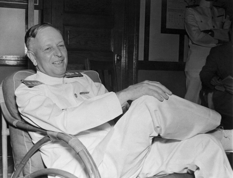 Husband E. Kimmel sitting in a chair