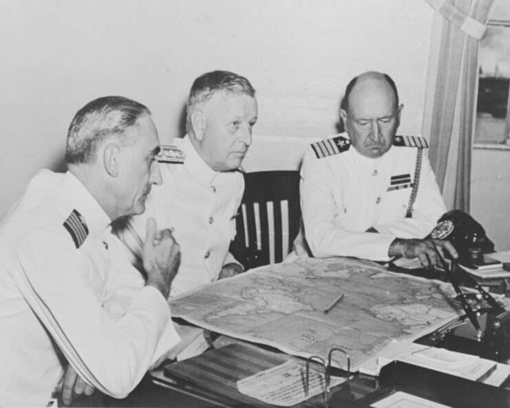 William "Poco" Smith, Husband E. Kimmel and Walter S. DeLany sitting at a table