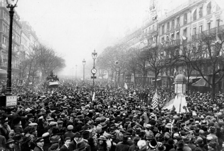 Crowd gathered in the middle of a city street