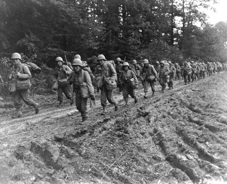 442nd Regimental Combat Team walking along a dirt road