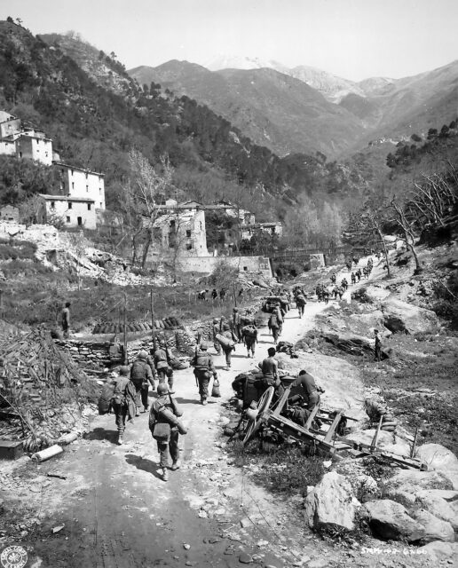 Members of the 92nd Infantry Division walking into Montignoso, Italy