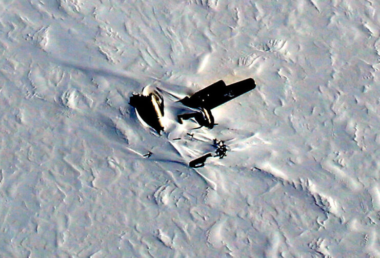 Aerial view of the Boeing B-29 Superfortress 'Kee Bird' partially buried in the snow