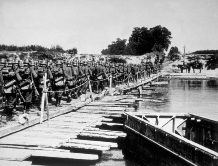 German soldiers walking across a bridge