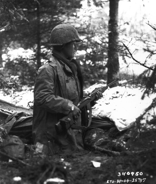 Sgt. Goichi Suehiro standing in the middle of a wooded area