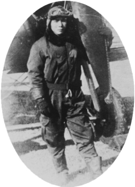 Shigenori Nishikaichi standing at the wheel of an aircraft