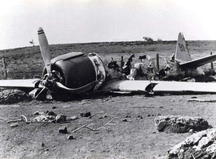 Damaged Mitsubishi A6M2 Zero in a field