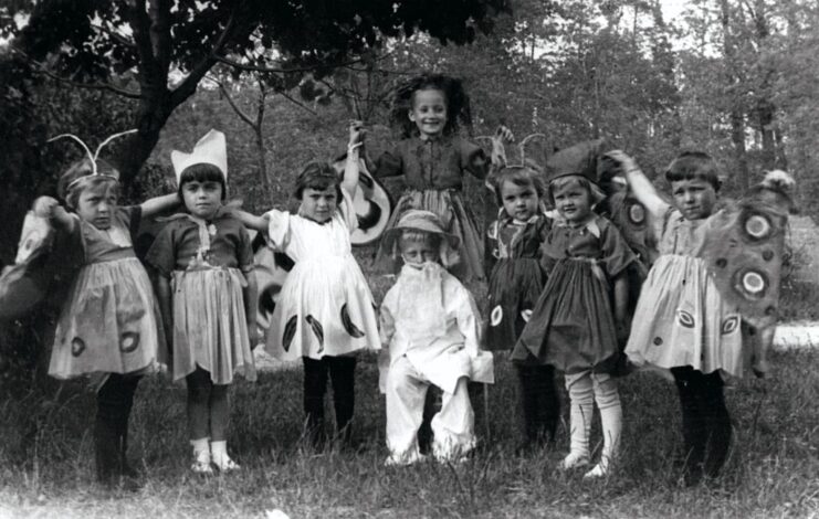 Eight children standing together outside