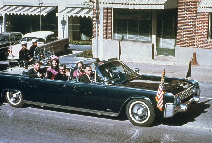 John Connally sitting in a convertible with John F. and Jackie Kennedy