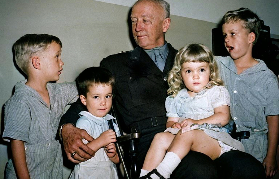 George Patton sitting with his four grandchildren