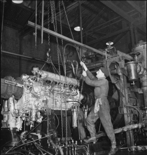 A Merlin engine is lifted off the Test Bed at this aircraft engine factory, after being tested. It will now be stripped, reassembled and given a second test before it is ready for dispatch.