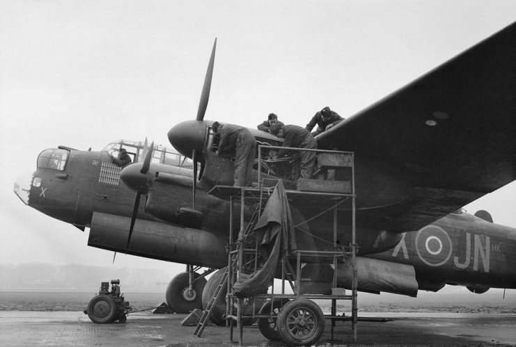 echanics working on the port-outer Merlin engine of a No 75 (New Zealand) Squadron Lancaster at Mepal, Cambridgeshire, 9 February 1945.