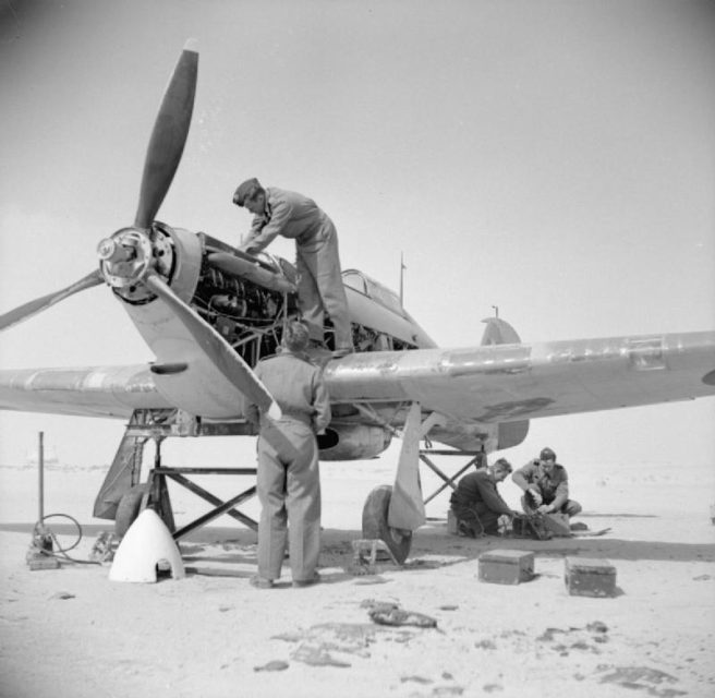 Fitters working on the engine of a Hawker Hurricane of No 237 (Rhodesian) Squadron, Royal Air Force in Iran.