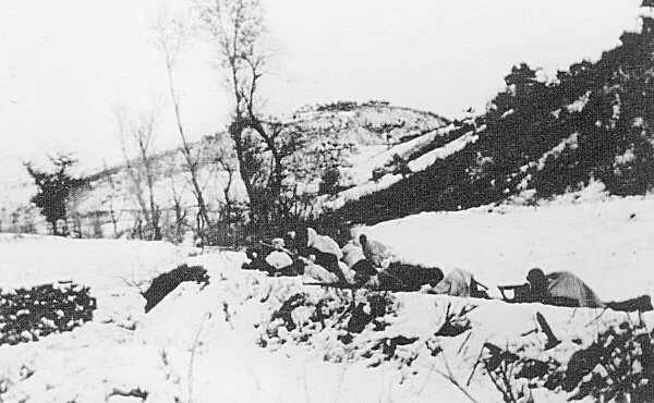Chinese troops lying in the snow