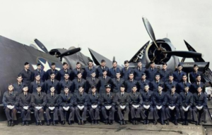 US Navy pilots sitting in front of an aircraft