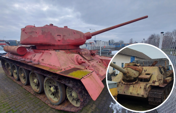 Pink T-34-85 parked behind a chain link fence + SD-100 parked between two buildings