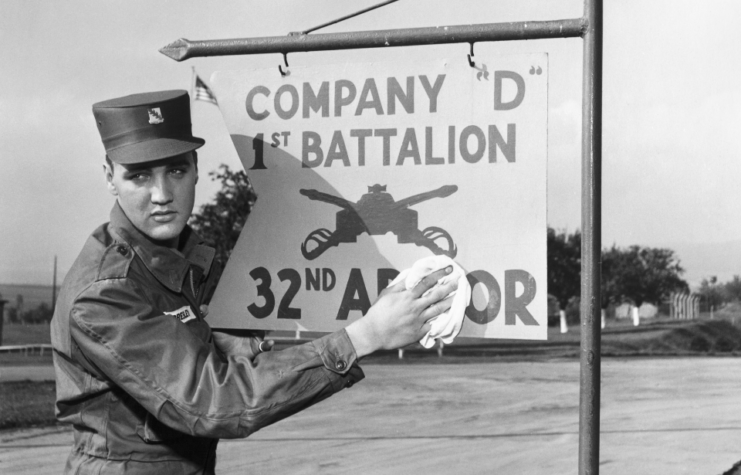 Elvis Presley poses for the camera during his military service at a US base in Germany.