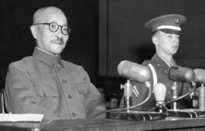 Hideki Tojo (1884 - 1948), former Japanese general, premier and war minister from December 2nd, 1941 to July, 1944, takes the stand for the first time during the International Tribunal trials in Tokyo, Japan, 1947.