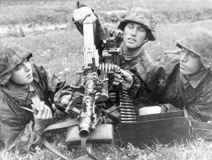 Three Waffen-SS troops manning a machine gun