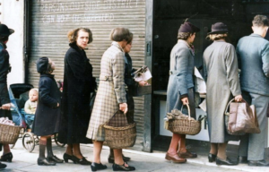 Crowd lining up outside of a fish monger