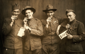 Four British soldiers eating chocolate