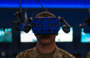 Chief Master Sgt. Brian Kruzelnick, command chief with Air Mobility Command, uses virtual reality goggles during a 317th Maintenance Group capabilities briefing at Dyess Air Force Base, Texas, July 8, 2021.