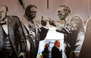 Exhibit featuring cutouts of Theodore "Teddy" Roosevelt and Woodrow Wilson