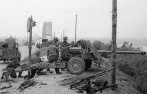 Troops with the 21st Anti-Tank Regiment, Guards Armoured Division manning an Ordnance QF 17-pounder near Nijmegen bridge