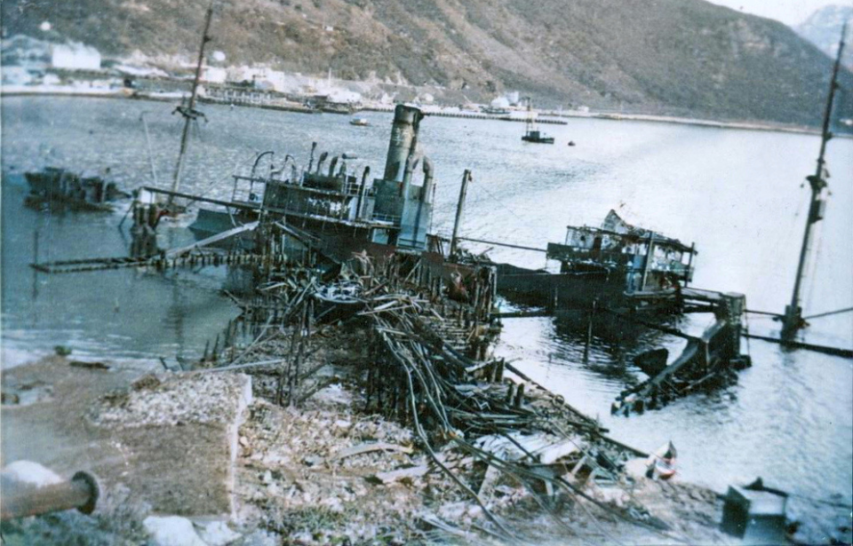 Remains of a destroyer half-submerged in water