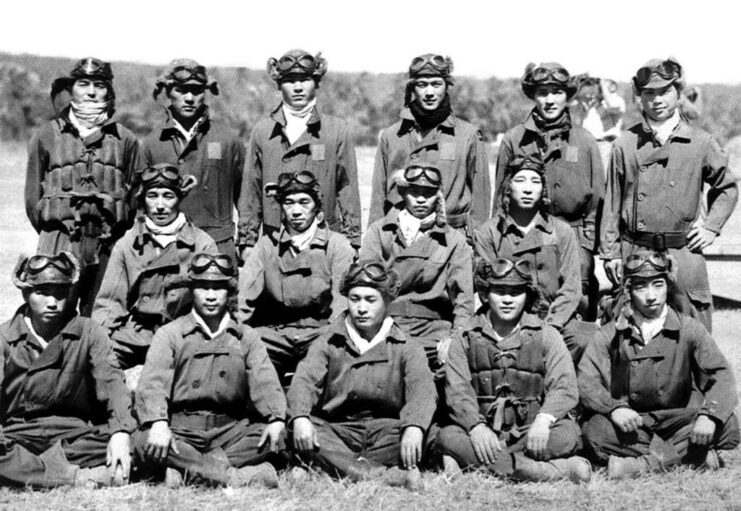 Portrait of Japanese pilots standing outside