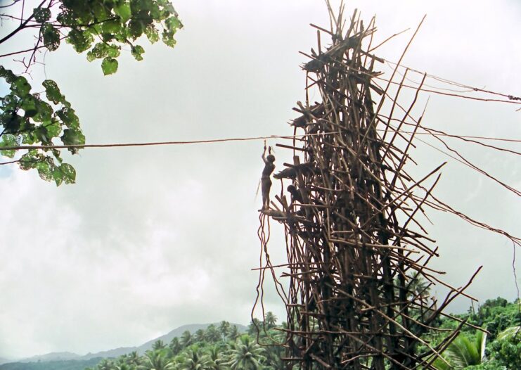 Man standing on the edge of a land diving platform