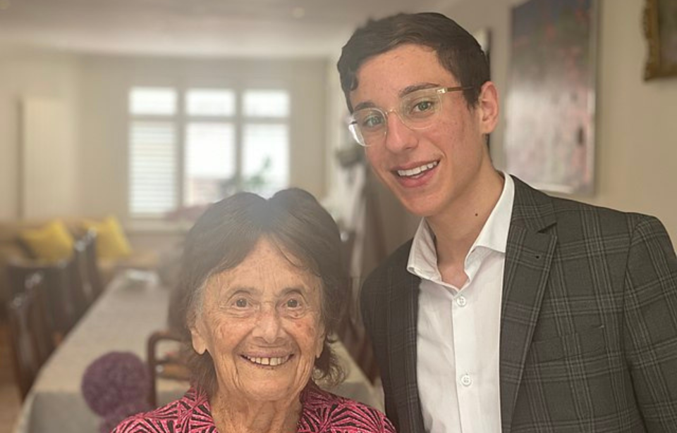 Lily Ebert and Dov Forman standing together in a room