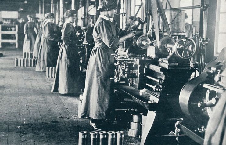 Munitionettes working at machines