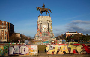 Robert E. Lee statue surrounded by concrete barriers