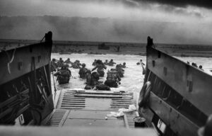 Troops wading to shore from a landing craft