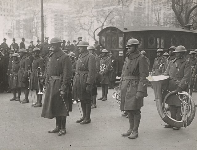 Members of the 369th Infantry Regiment standing together outside