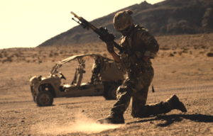 Member of the Royal Marines running in the desert