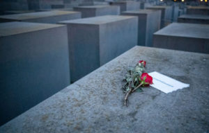 A rose atop a concrete slab at the Holocaust memorial