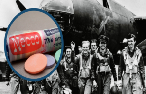 Necco wafers and a group of airmen by an aircraft.